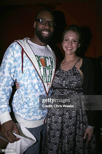 Player Baron Davis, left, and actress Jessica Alba attend Davis' birthday at Stone Rose Lounge on March 22, 2008 in Beverly Hills, CA.
