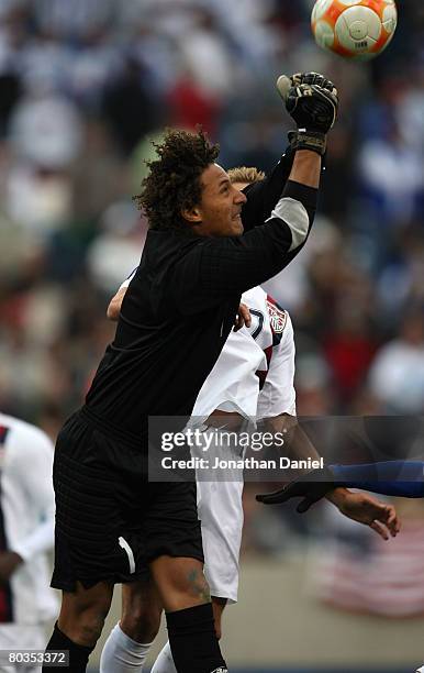 Goalkeeper Kevin Hernandez of Honduras punches the ball away on a shot attempt by the United States during the final match in the CONCACAF U-23 Men's...