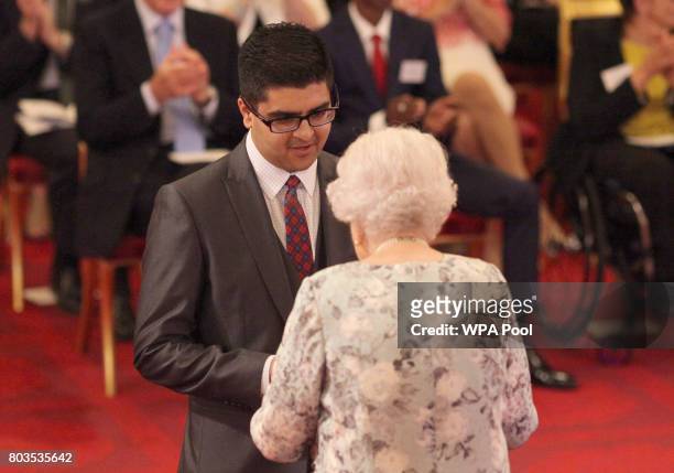 Usman Ali, from East Renfrewshire, receives a Queen's Young Leaders Award for 2017 from Queen Elizabeth II at the 2017 Queen's Young Leaders Awards...