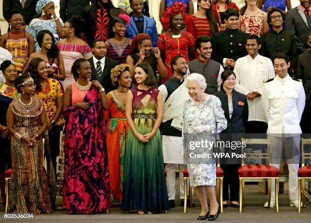 Queen Elizabeth II, walks past some of the Young Leaders, after posing for a group photo at the 2017 Queen's Young Leaders Awards Ceremony at...