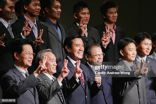 Taiwan's President-elect Ma Ying-jeou poses with officials and players of the Chinese Taipei baseball team during a lunch to celebrate the team's...