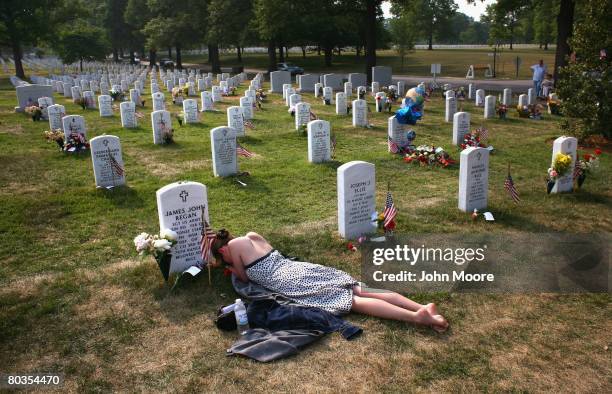 Mary McHugh mourns her slain fiance Sgt. James Regan at "Section 60" of the Arlington National Cemetery May 27, 2007. On March 24 four soldiers were...