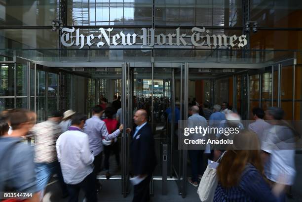 People enter the New York Times building in New York, United States on June 29, 2017. NYT employees start a temporary strike against downsizing and...