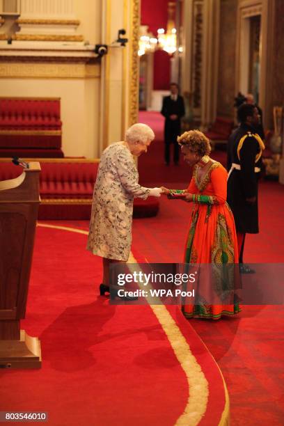 Ms Farai Mubaiwa from South Africa receives a Queen's Young Leaders Award for 2017 from Queen Elizabeth II at the 2017 Queen's Young Leaders Awards...