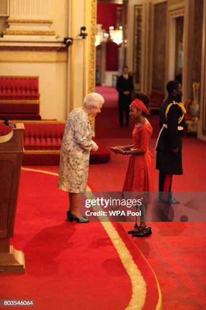 Miss Chaikhwa Lobatse from Botswana receives a Queen's Young Leaders Award for 2017 from Queen Elizabeth II at the 2017 Queen's Young Leaders Awards...