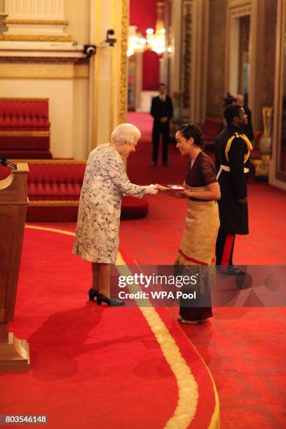 Ms Elizabeth Kite from Tonga receives a Queen's Young Leaders Award for 2017 from Queen Elizabeth II at the 2017 Queen's Young Leaders Awards...