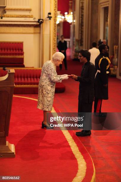 Mr. Senel Wanniarachchi from Sri Lanka receives a Queen's Young Leaders Award for 2017 from Queen Elizabeth II at the 2017 Queen's Young Leaders...