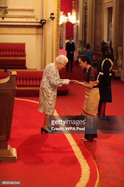 Ms Elizabeth Kite from Tonga receives a Queen's Young Leaders Award for 2017 from Queen Elizabeth II at the 2017 Queen's Young Leaders Awards...