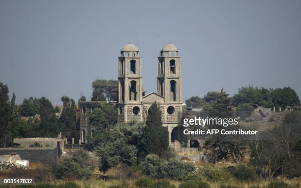 Picture taken from the Israeli side of the occupied Golan Heights shows a church, destroyed during the 1967 war, in the Syrian border town of...