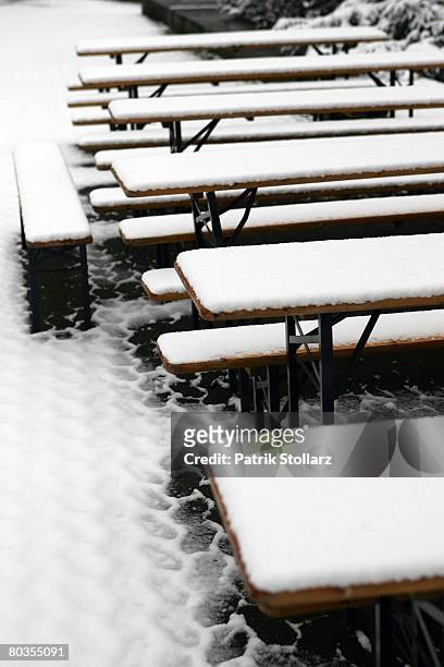 Snow covered chairs and benches of a restaurant are pictured on March 24, 2008 in Duesseldorf, Germany. Currently, the rhine river area is hit by...