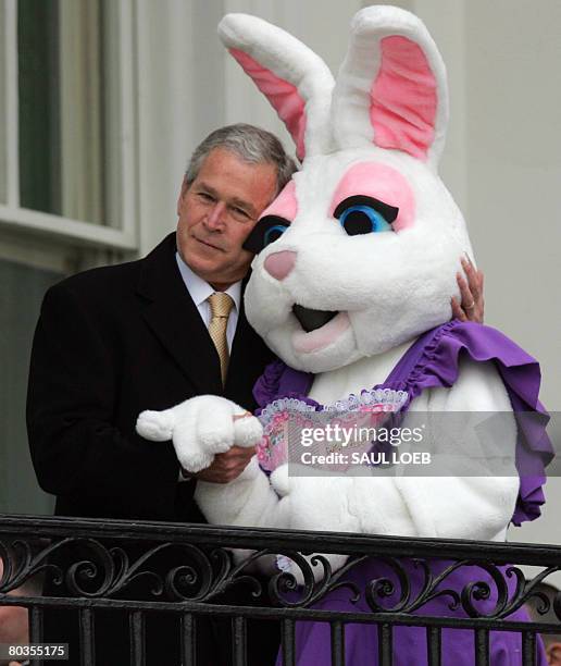 President George W. Bush hugs the Easter Bunny during the annual Easter Egg Roll on the South Lawn of the White House in Washington, DC, on March 24,...