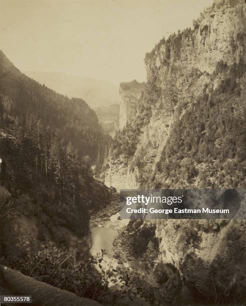 View from a stone bridge across the gorge of Via Mala, a portion of the Splugen Pass that connects Italy and Switzerland, mid to late 19th century.