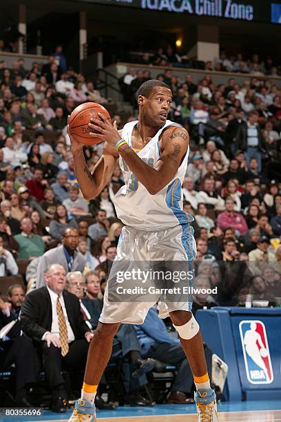 Marcus Camby of the Denver Nuggets moves the ball during the NBA game against the Washington Wizards on February 8, 2008 at the Pepsi Center in...