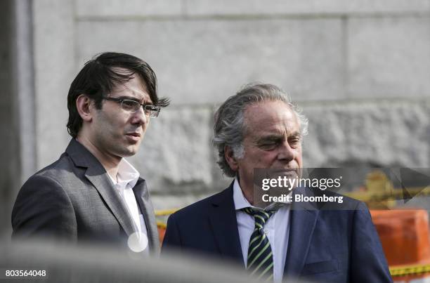 Martin Shkreli, former chief executive officer of Turing Pharmaceuticals AG, left, exits federal court with his attorney Benjamin Brafman in the...