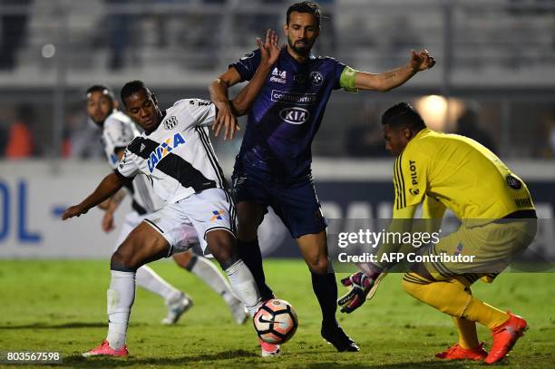 Victor Mareco of Paraguay's Sol de America vies for the ball with Lins and goalkeeper Aranha of Brazils Ponte Preta during their 2017 Copa...