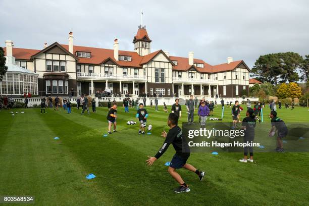 Children take part in a drill during a New Zealand All Blacks skills and drills session on the North Lawn of Government House on June 30, 2017 in...