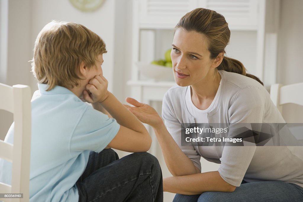 Mother having discussion with son