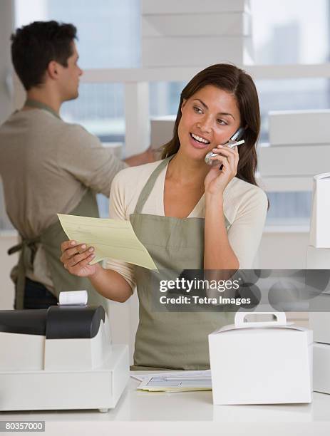 multi-ethnic bakery workers behind counter - baker occupation stock pictures, royalty-free photos & images