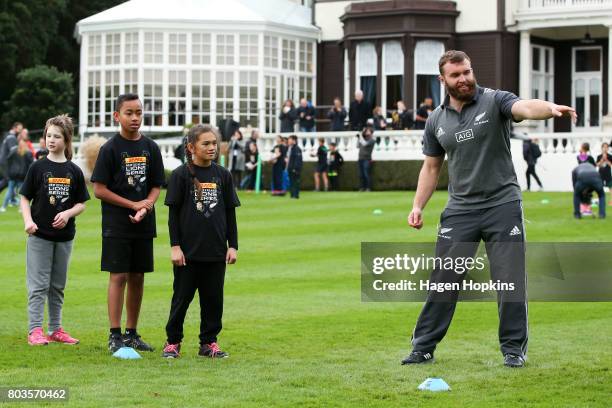 Liam Coltman directs a drill during a New Zealand All Blacks skills and drills session on the North Lawn of Government House on June 30, 2017 in...