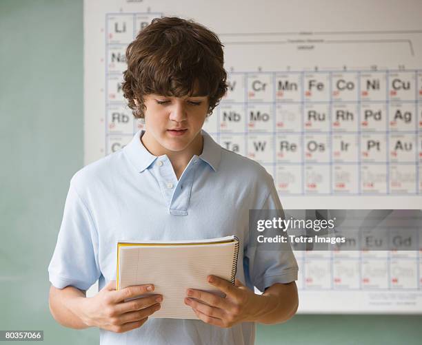 teenaged boy giving speech in science class - boy giving speech stock pictures, royalty-free photos & images