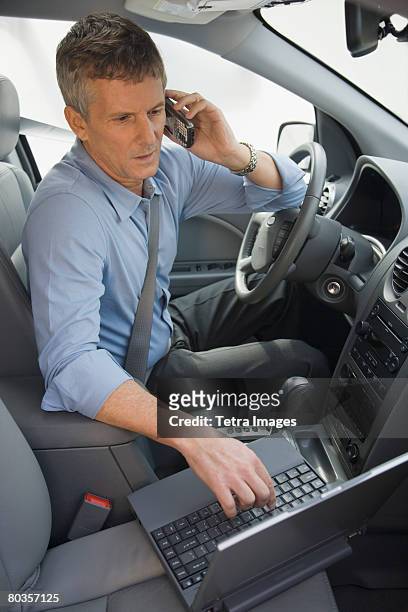 businessman working in car - unhappy salesman stock pictures, royalty-free photos & images