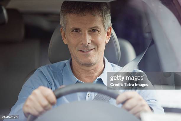 man driving car - front view foto e immagini stock