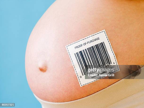 pregnant woman's belly with barcode - remplacement photos et images de collection