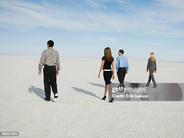 businesspeople walking on salt flats, salt flats, utah, united states - 斜めから見た図 ストックフォトと画像