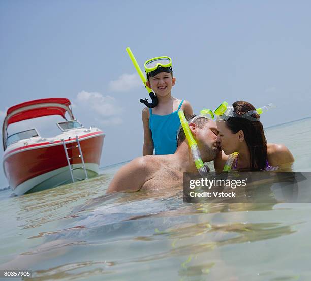 family with snorkeling gear in water, florida, united states - embarrased dad stockfoto's en -beelden