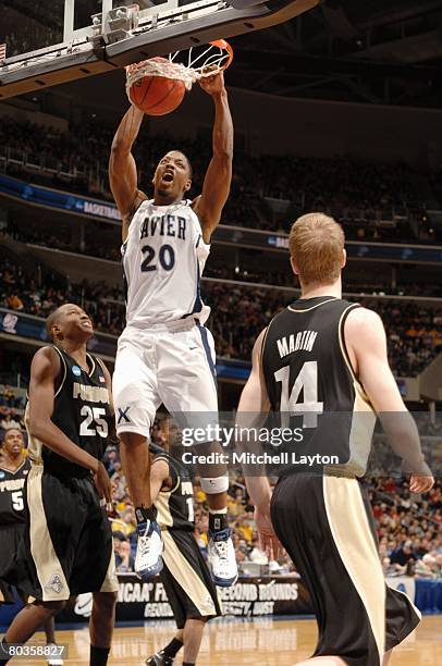 Anderson#20 of the Xavier Musketeers goes to the basket during a NCAA Men's Basketball 2nd round game against the Purdue Boilermakers at Verizon...