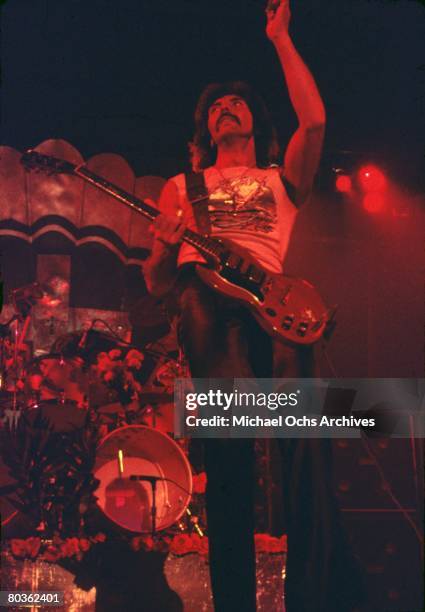 Guitarist Tony Iommi of the heavy-metal group "Black Sabbath" plays a Gibson SG electric guitar as he performs onstage in circa 1975.