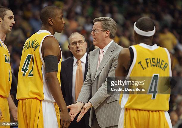 Coach Fran McCaffery of the Siena Saints talks with his team during a timeout in their game against the Vanderbilt Commodores in the first round of...
