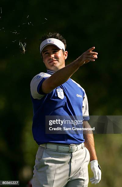 Trevor Immelman of South Africa checks the wind on the 16th hole during the first day of the Tavistock Cup at the Isleworth Golf and Country Club...