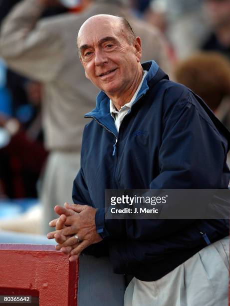 College basketball analyst Dick Vitale stands over the dugout prior to the start of the Grapefruit League Spring Training game between the Cincinnati...