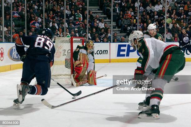 Brent Burns of the Minnesota Wild covers a breaking Sam Gagner of the Edmonton Oilers at Rexall Place on March 24, 2008 in Edmonton, Alberta, Canada.