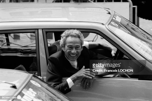 Portrait de Lucien Jeunesse en voiture, le 17 juillet 1976 à Paris, France.