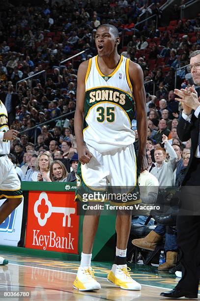 Kevin Durant of Seattle SuperSonics cheers on his fellow Sonics in the game against the Portland Trail Blazers on March 24, 2008 at the Key Arena in...