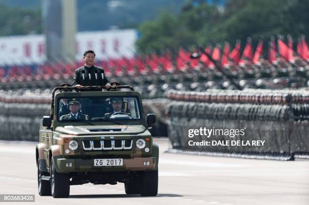 China's President Xi Jinping inspects People's Liberation Army soldiers at a barracks in Hong Kong on June 30, 2017. - Xi tours a garrison of Hong...