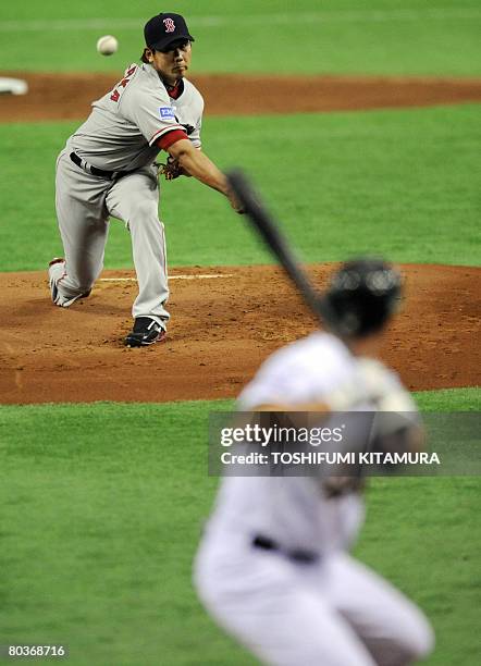 Boston Red Sox Japanese pitcher Daisuke Matsuzaka throws the ball to Oakland Athletics second baseman Mark Ellis during the first inning of their...