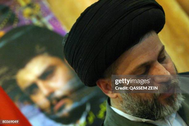 Hazam al-Aaraji, representative of Iraq's radical Shiite cleric Moqtada al-Sadr , attends a press conference in the Shiite holy city of Najaf on...