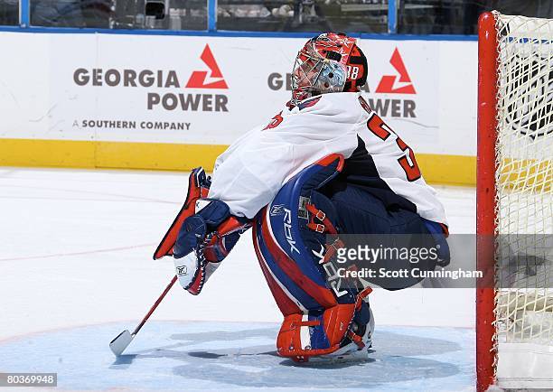 Cristobal Huet of the Washington Capitals relaxes during a break in the game against the Atlanta Thrashers at Philips Arena on March 21, 2008 in...
