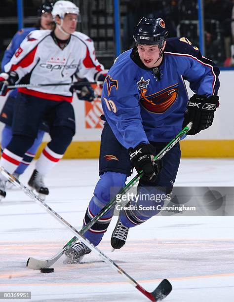Colby Armstrong of the Atlanta Thrashers carries the puck against the Washington Capitals at Philips Arena on March 21, 2008 in Atlanta, Georgia.
