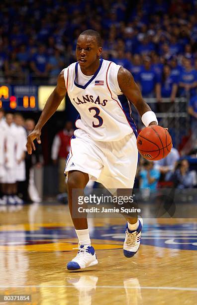 Russell Robinson of the Kansas Jayhawks dribbles the ball against the Kansas State Wildcats during their game on March 1, 2008 at Allen Fieldhouse in...