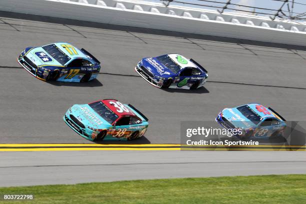 David Ragan, Ricky Stenhouse Jr., Trevor Bayne, and Darrell Wallace Jr. In turn 3 dduring practice for the Coke Zero 400 Monster Energy Cup Series...