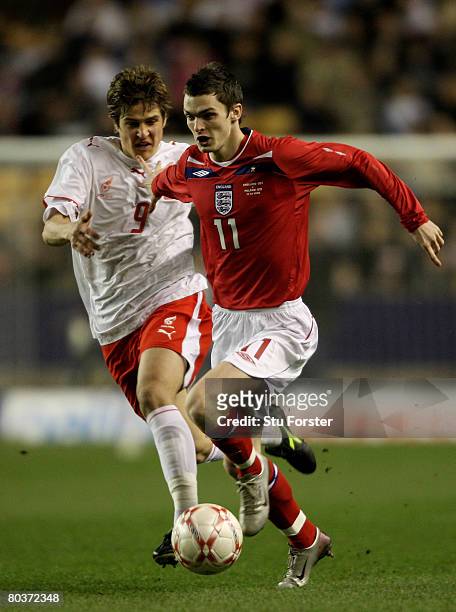 England winger Adam Johnson bursts through a challenge during the Under-21 International Friendly between England and Poland at Molineux on March 25,...