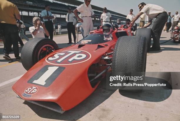 American racing driver Mario Andretti pictured in the driver's seat of the McNamara Ford racing car of the STP Oil Treatment Andy Granatelli team,...