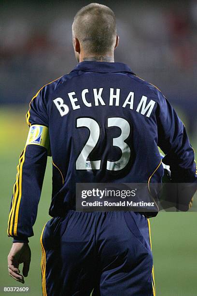 Midfielder David Beckham of the Los Angeles Galaxy carries the ball against FC Dallas during a charity preseason match on March 15, 2008 at Pizza Hut...