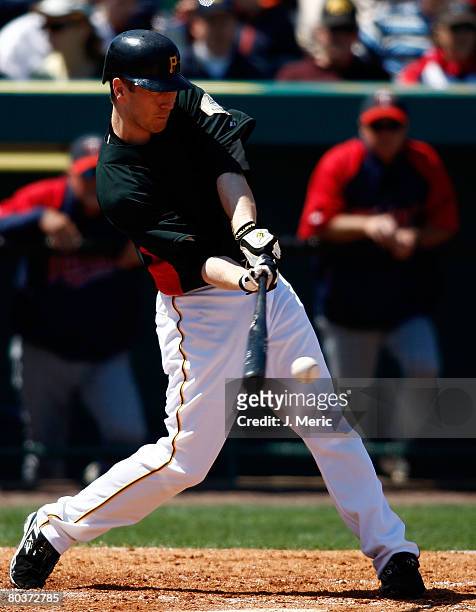 Outfielder Jason Bay of the Pittsburgh Pirates connects on a pitch against the Minnesota Twins during the Grapefruit League Spring Training game on...