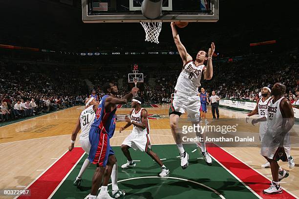 Andrew Bogut of the Milwaukee Bucks rebounds against the Detroit Pistons during the game on February 20, 2008 at the Bradley Center in Milwaukee,...