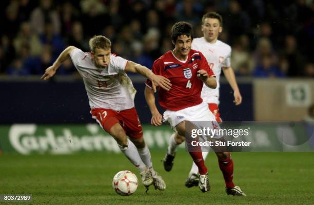 England player Andrew Surman bursts past the challenge of Adam Danch during the Under-21 International Friendly between England and Poland at...